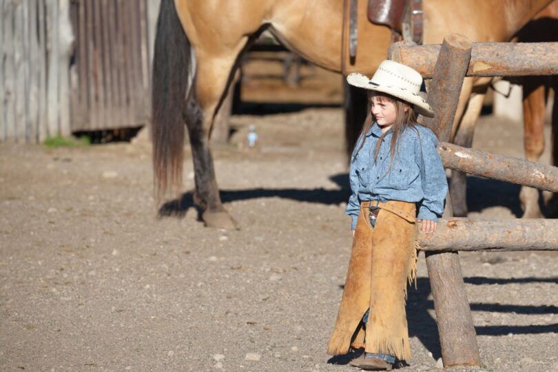 girl wearing cowboy hat